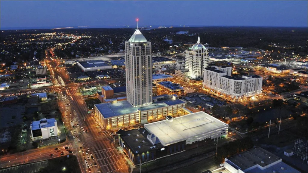 Aerial view of a downtown city center with high-rise towers at dusk